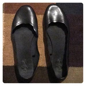 Black faux leather flats